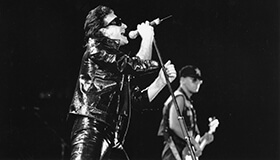 U2 performing on stage.