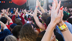 Audience clapping at a concert.