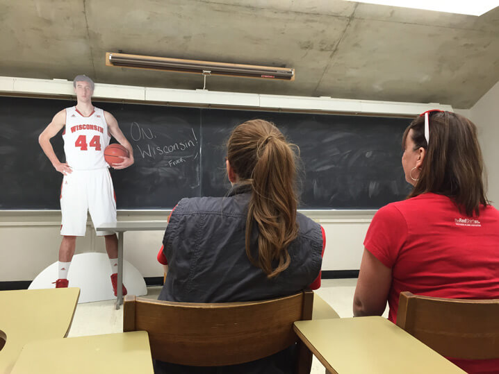 Cut-out of Frank Kaminsky leads a class.