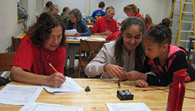 GPU instructor, grandparent and grandchild in class.