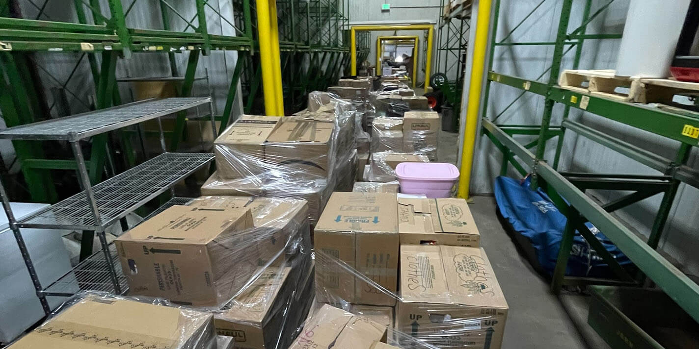 Boxes of clothing and hygiene items stored in Fort McCoy