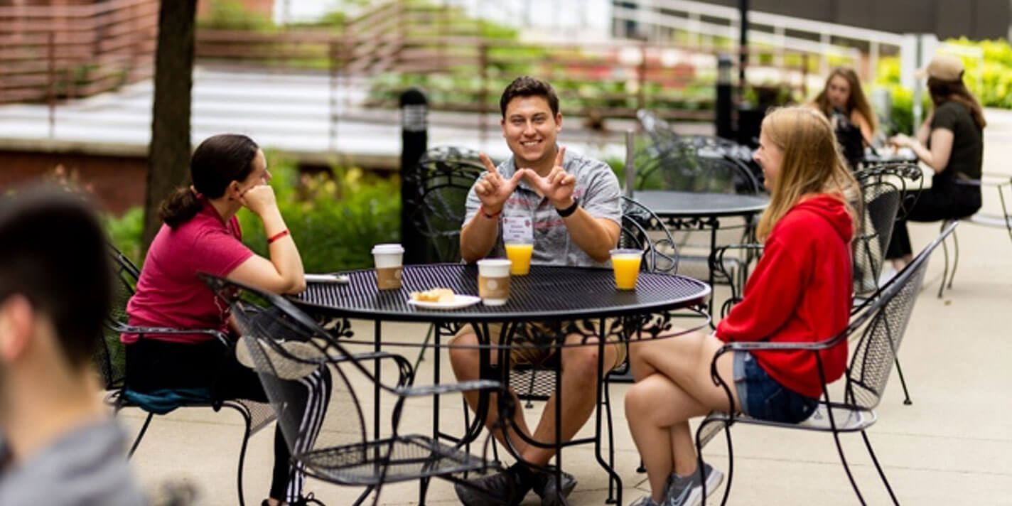 People at a table at the Red Gym