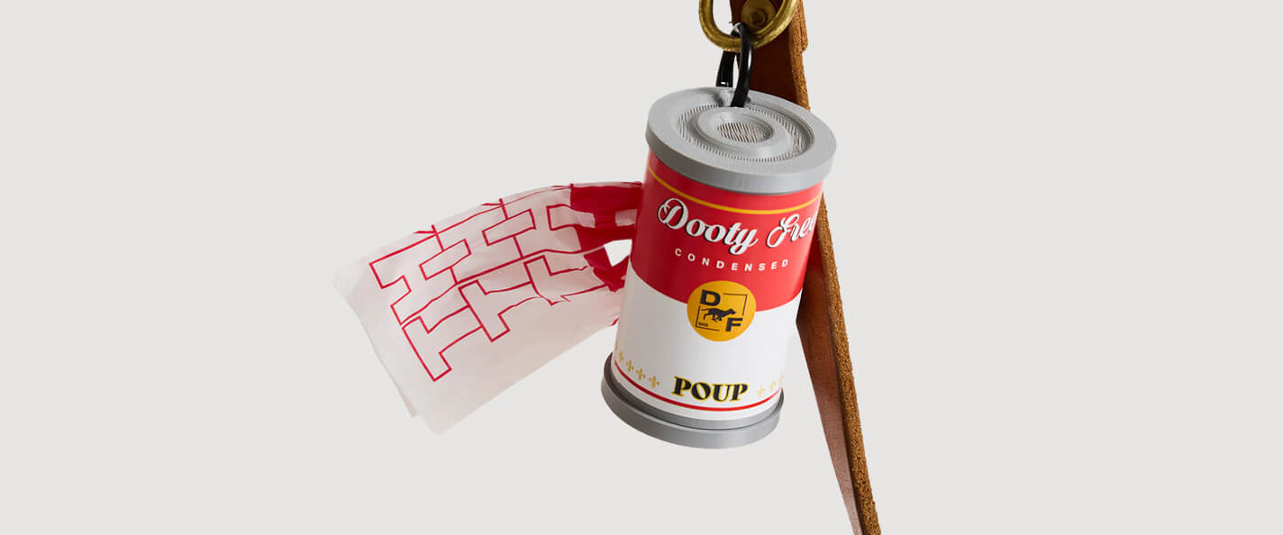 A waste bag dispenser shaped like a can of soup.