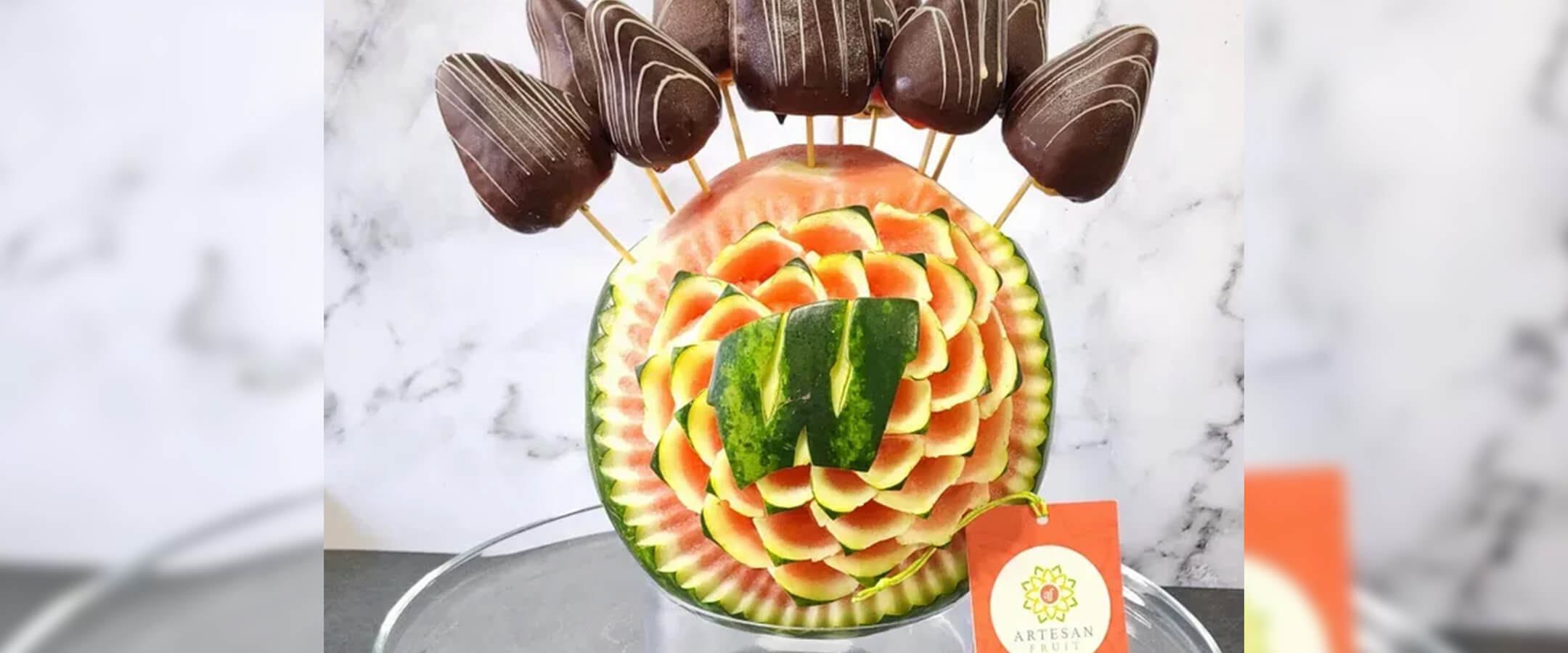 Motion W carved into a melon.