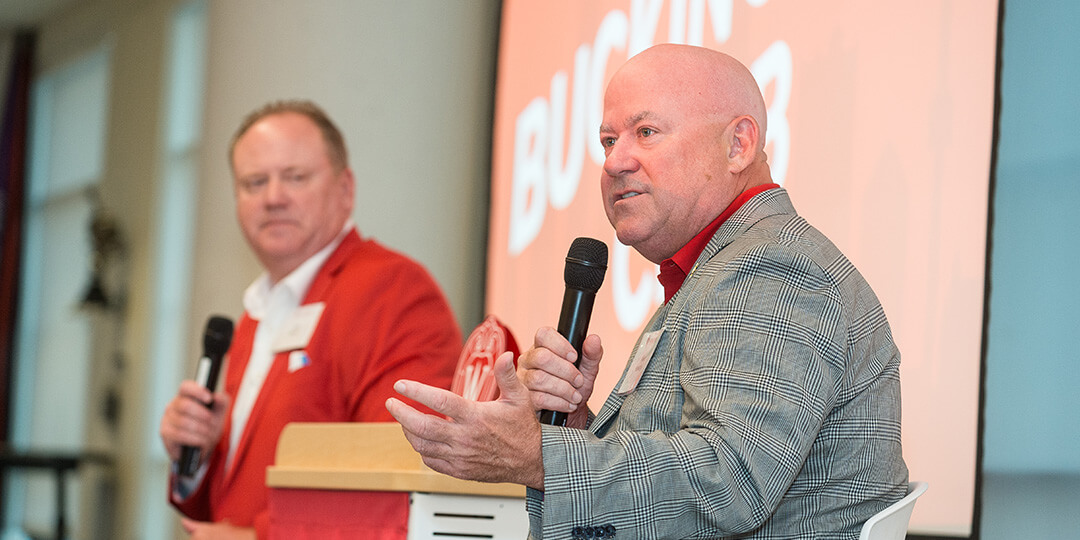 Coach Mike Hastings speaks to UW supporters.