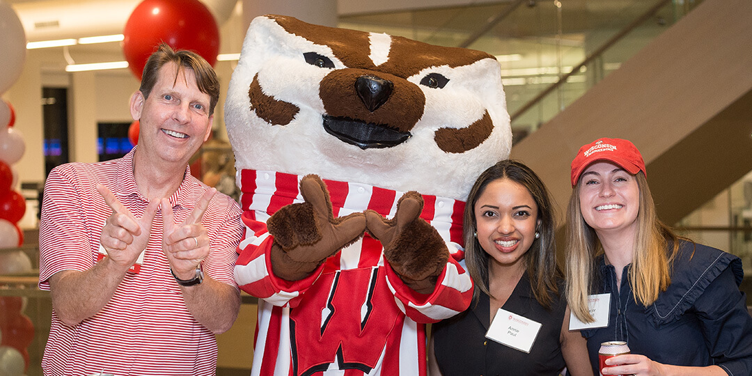Bucky throws a W with by three Twin Cities alumni.