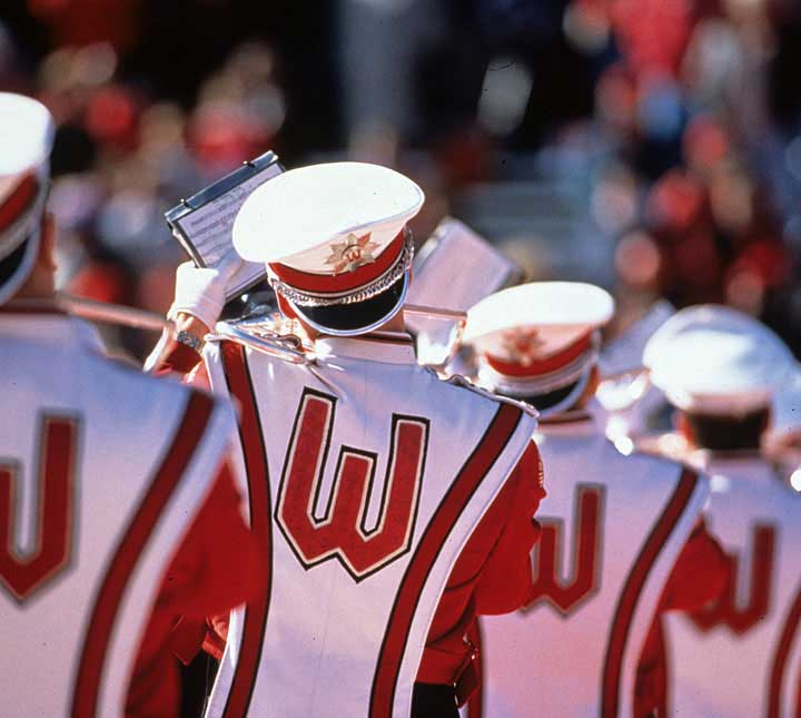 The marching band performing during the Fifth Quarter celebration, 1999. According to tradition, their hats are backward representing a look back at a victory. Photo courtesy UW-Madison Archives, University of Wisconsin Collection