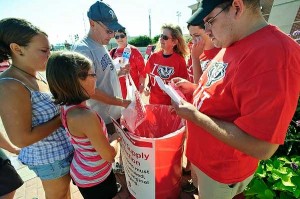 Volunteers collect school supplies at UW-Madison Day at the State Fair, August 2011; photo by Bryce Richter, University Communications